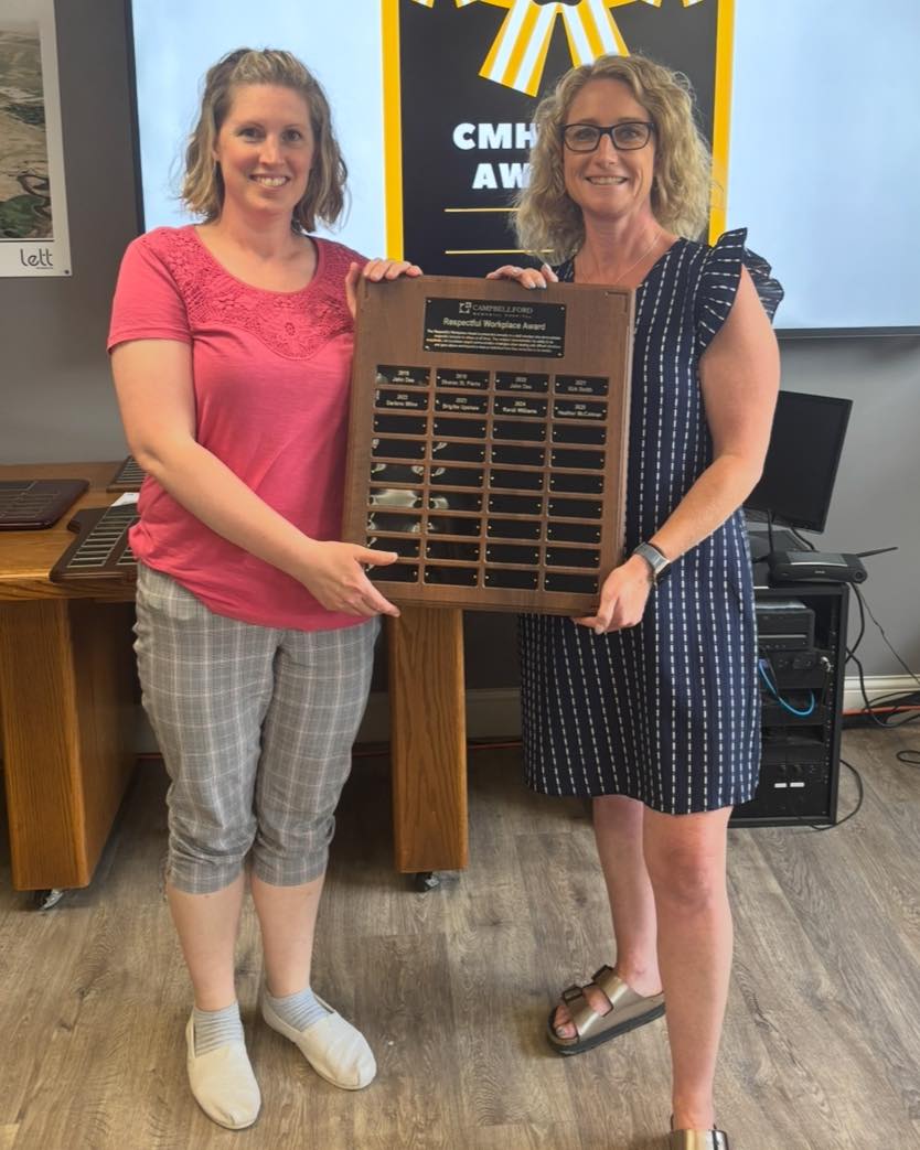 Heather McColman receiving award